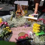'Everybody has a Dolly Parton song' - World mourns country music legend