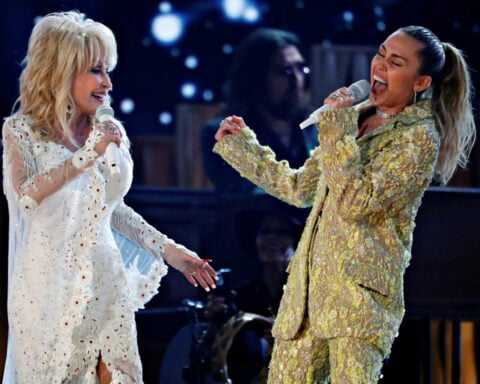Miley Cyrus pays tribute to godmother Dolly Parton after singer's death at 80
