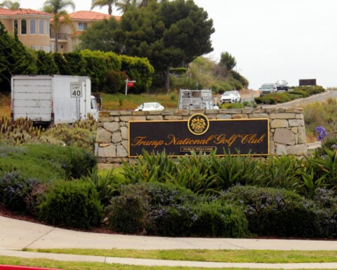 A judge suspends charges against an ex-Marine arrested on Trump's golf course with ammunition
