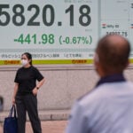 Asian stocks are mixed after Wall Street losses following economic updates