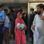 Pakistani investigators visiting hospital nursery where fire killed 14 newborns