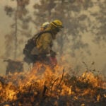 Extreme heat is taking a toll on firefighters as wildfires stretch crews to the limit
