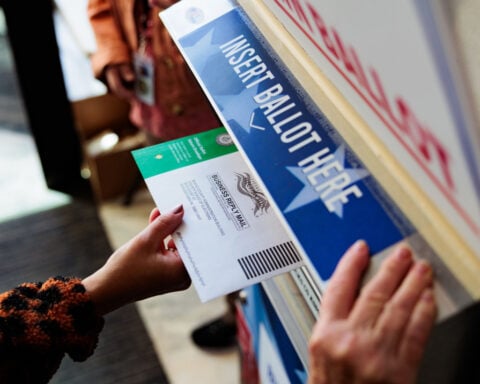 Judge pauses US Postal Service plan to implement Trump’s new mail voting restrictions