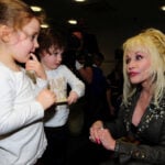 Dolly Parton's legacy lives on through book deliveries to kids