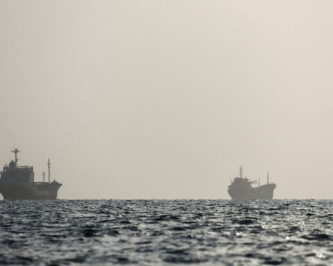 Iran urges other nations not to join new US sanctions, mediators focus on reopening strait