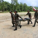 Lake overflows on Nepal-China border, sparking panic and halting rescue