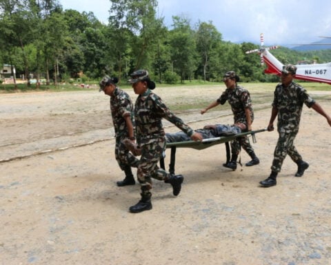 Lake overflows on Nepal-China border, sparking panic and halting rescue