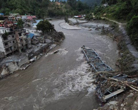 Nepal and China resume flood rescue after lake threat eases, death toll nears 600