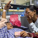 Mother reunited with 8-year-old who climbed trees to survive Nepal floods