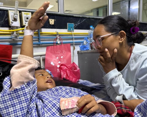 Mother reunited with 8-year-old who climbed trees to survive Nepal floods