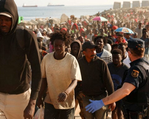 Spain asks EU for help processing migrants in Ceuta