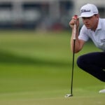 Hovland surges to a 1-shot lead at Tour Championship with cast of challengers lined up behind him