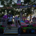 Spinning and dipping, Minnesota fairgoers delight in the classic Tilt-A-Whirl ride as it turns 100