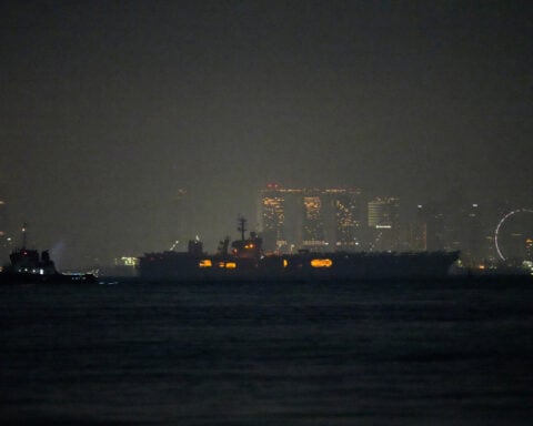 USS Abraham Lincoln sails past Singapore on its way home from Middle East