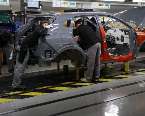 UK manufacturing PMI slips to five-month low but hiring strengthens