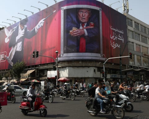 Iran urges US to comply with interim deal after Trump threatens further strikes
