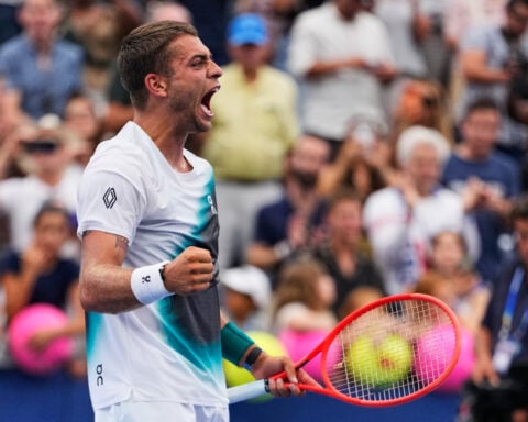 No. 5 Cobolli rallies from two sets down at the US Open as play picks up after a morning of rain
