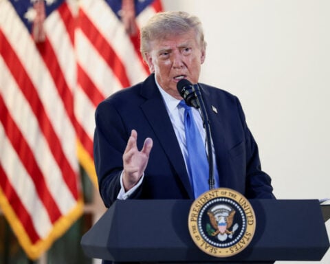 Trump signs bill to avert government shutdown before midterm elections