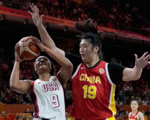 Caitlin Clark helps US beat China and 7-foot-3 Zhang Ziyu 94-61 in women's World Cup opener