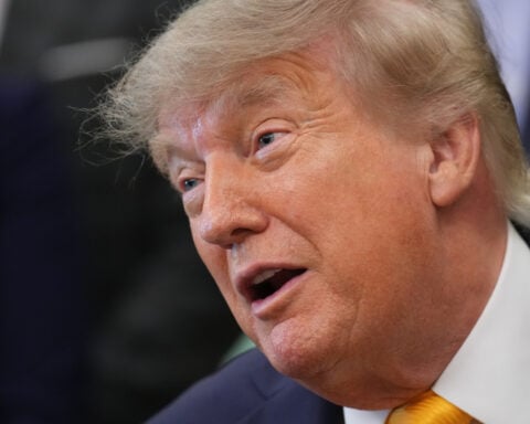 The Latest: Federal judge extends block on Trump’s order seeking to limit midterm mail-in voting