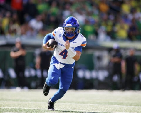 Moore throws for 3 TDs and No. 2 Oregon overcomes a slow start to beat Boise State 34-27