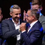 German chancellor faces tough times after first far-right party's state election win since Nazi era