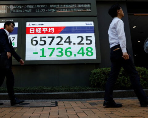 Asia stocks fall as yen surges, Iran warns US of retaliation