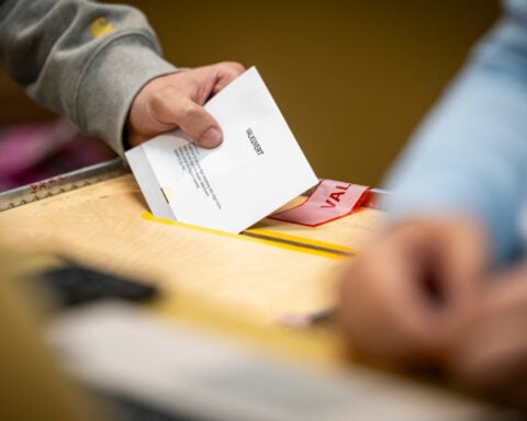 Swedish voters go to polls to choose a new parliament as hard right bids for role in government