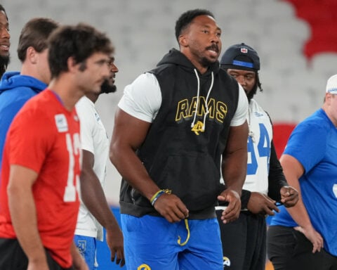Rams star Myles Garrett will have knee surgery, expected to miss 4 games, AP source says