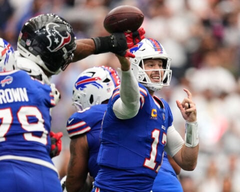 Josh Allen connects with Joshua Palmer for a late TD and Bills beat Texans 36-31 in wild opener