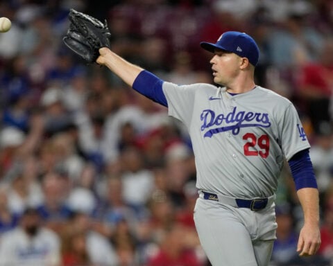 A quiet toast as the Dodgers clinch record-tying 14th straight playoff spot