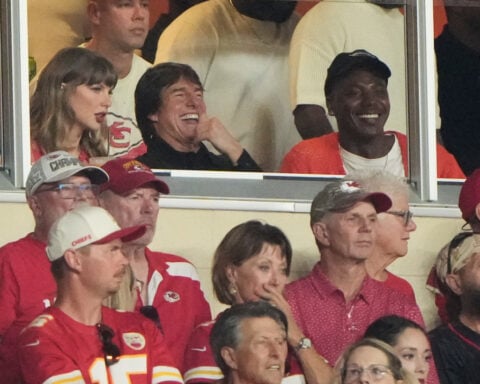 Taylor Swift skips the Emmys for Arrowhead, cheering on hubby Travis Kelce alongside Tom Cruise
