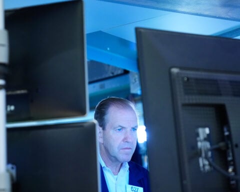 US stocks slip after oil prices and the bond market crank up the pressure