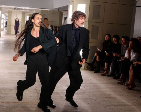 US fashion council CEO takes leave after grabbing runway show protesters