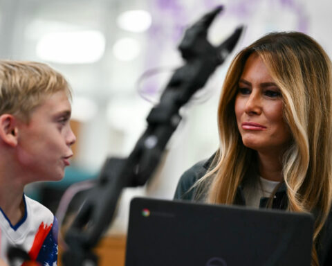 As AI debate flares, Melania Trump touts the technology as she tours North Carolina school