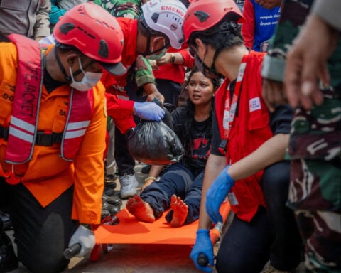 Families desperate for news as 129 still missing four days after capsize of ship in Indonesia's Java Sea