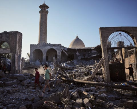 A damaged building collapses in Gaza, killing at least 12 people and other Mideast developments