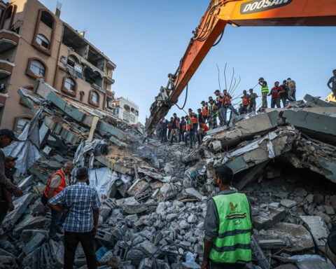 Gaza building collapse kills more than 20, dozens remain trapped under rubble