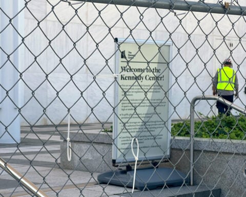 Fencing goes up around the main Kennedy Center building after Trump-aligned board votes to close it