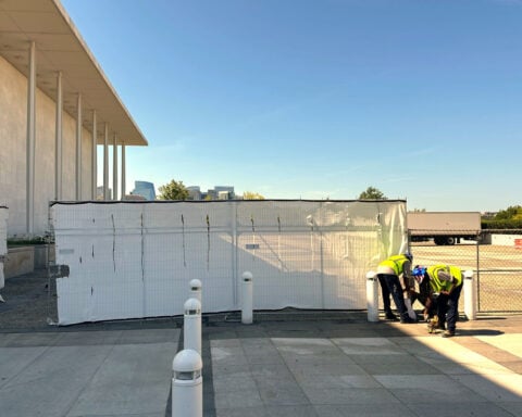 Fencing goes up around the main Kennedy Center building after Trump-aligned board votes to close it
