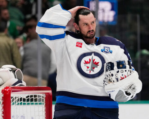 Jets suspend goalie Connor Hellebuyck for failing to report to training camp
