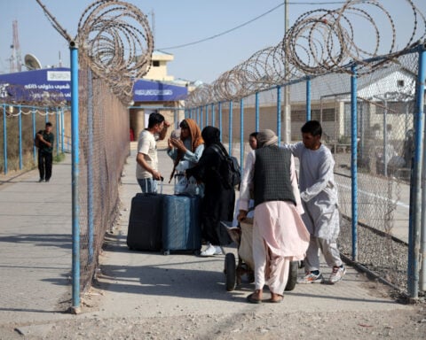 Impoverished by war in Iran, Afghan migrants return to Taliban rule