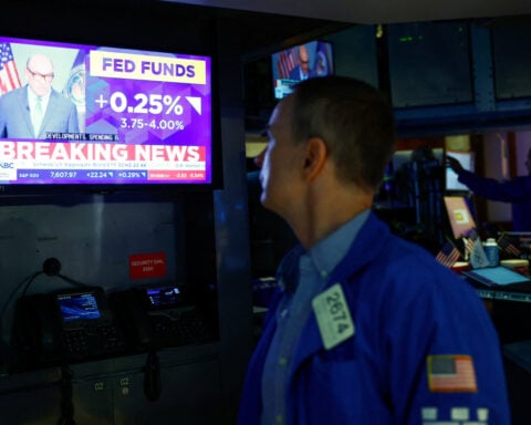 Tech leads Wall St to higher close as oil eases, Treasury yields dip