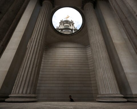 Bank of England halts long-dated gilt sales, rewrites plan to unwind QE
