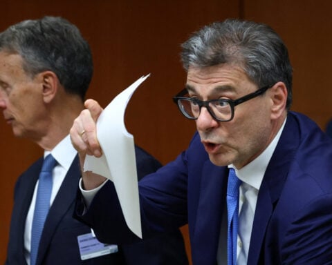 Italy's debt burden rising at alarming rate, economy minister says