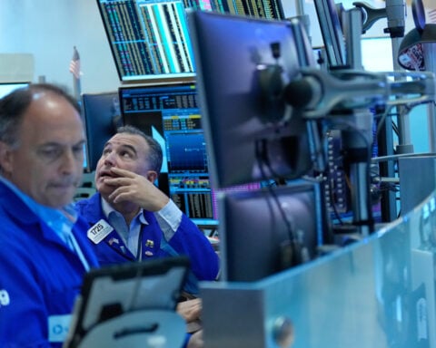 Wall Street drifts lower as bond yields rise and oil prices swing