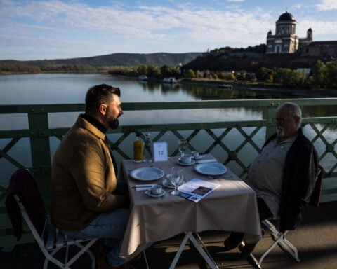 Hungarians and Slovaks share breakfast on Danube bridge that survived war and division