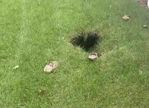 Woman rescued after plunging into hole in her backyard on her birthday