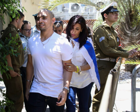 Israel's president pardons a combat medic whose shooting of a Palestinian attacker caused debate