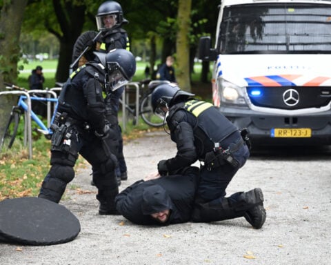 Dutch riot police break up far-right protest in The Hague after violence erupts